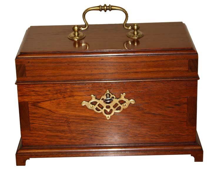 Mahogany tea caddy with brass handle and escutcheon