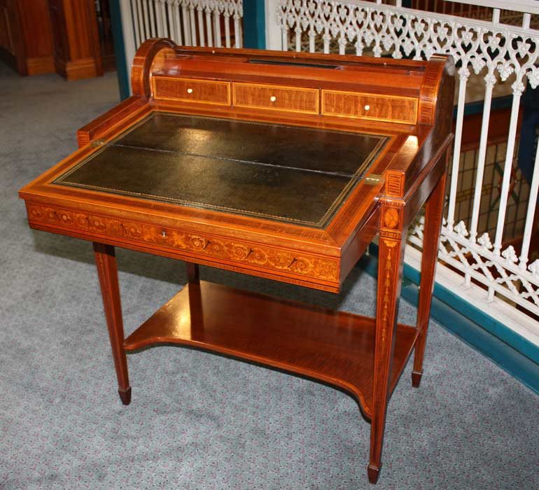 Inlaid writing desk with a leather writing surface